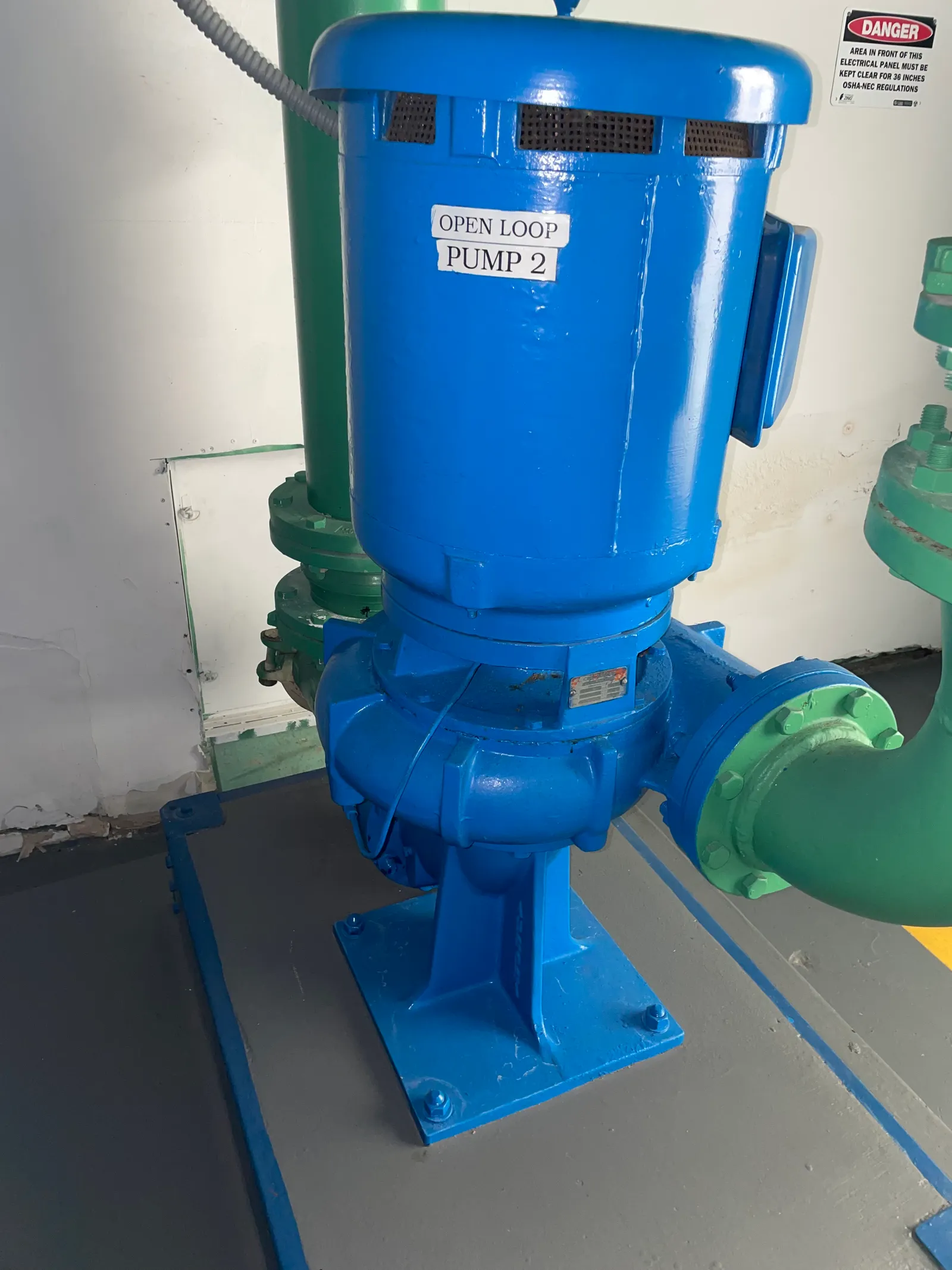 Blue vertical AC pump labeled Open Loop Pump 2 after overhaul