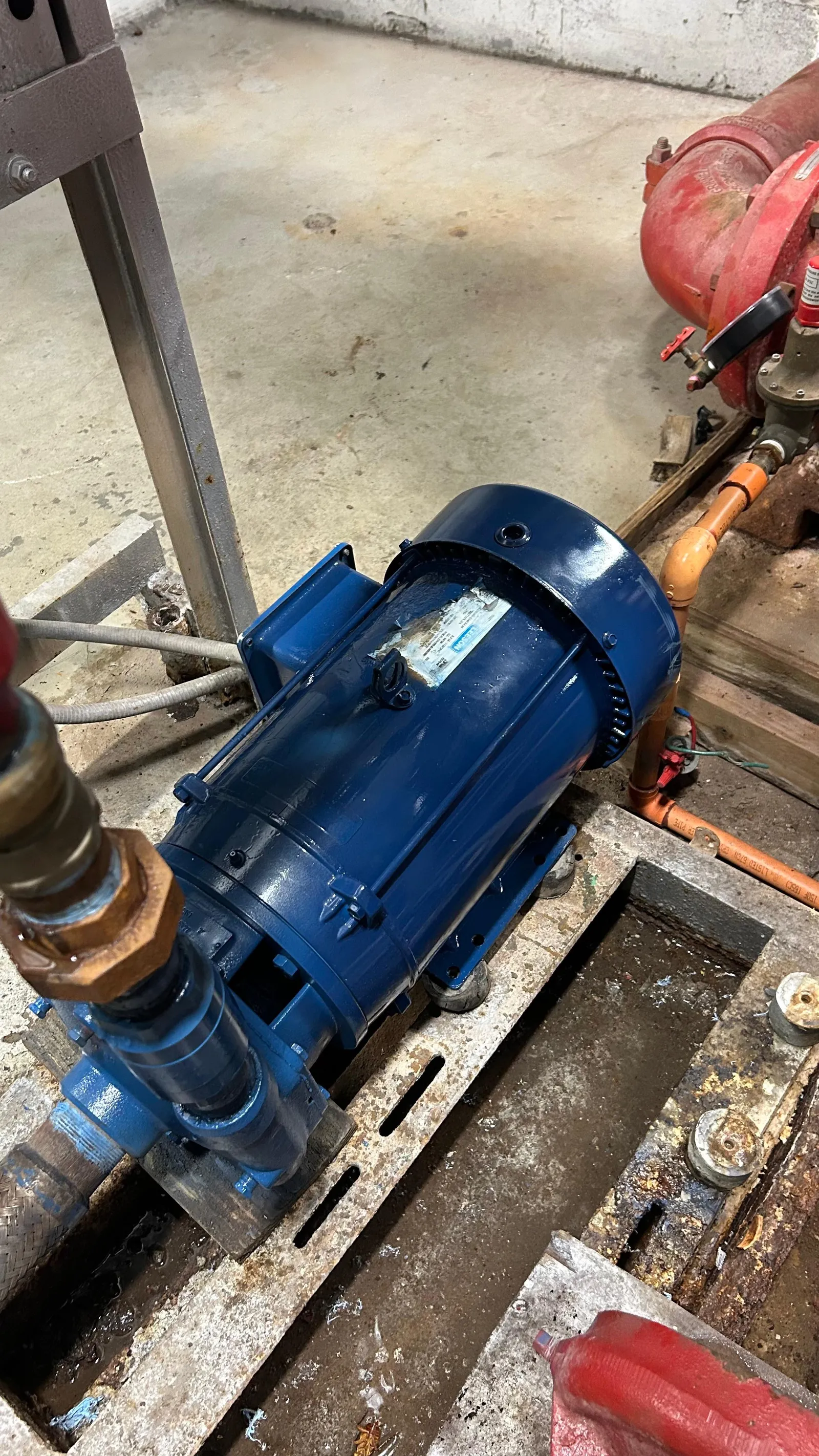 The same domestic water pump motor rebuilt, repainted, and reinstalled