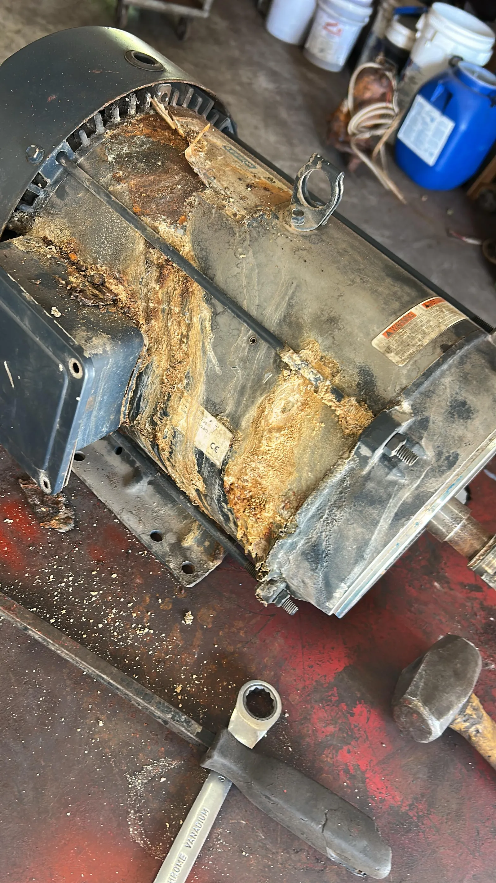 Failed, corroded domestic water pump motor before repair