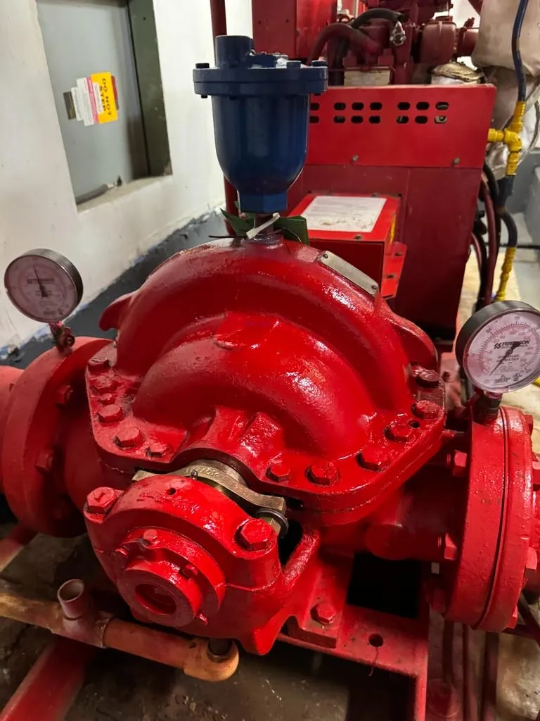Overhauled red horizontal split-case fire pump with new gauges