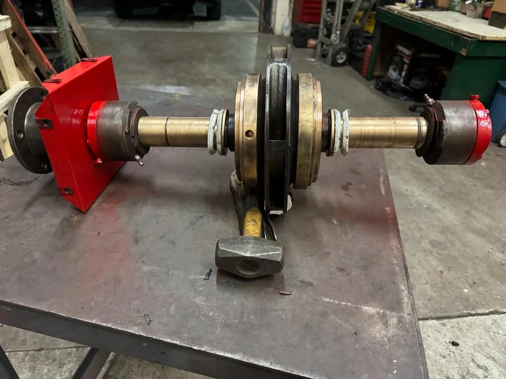 Rebuilt pump shaft with new bearings and seals on the shop bench